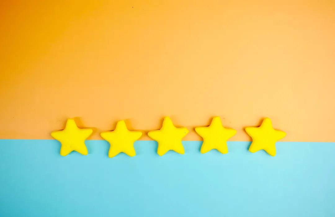 Five yellow stars on an orange and teal background representing a five-star customer review.