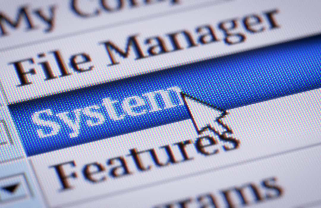 Computer screen showing a menu with the word ‘System’ highlighted and a cursor pointing to it
