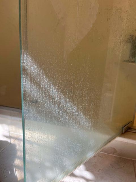 Glass door edge coated in mineral film